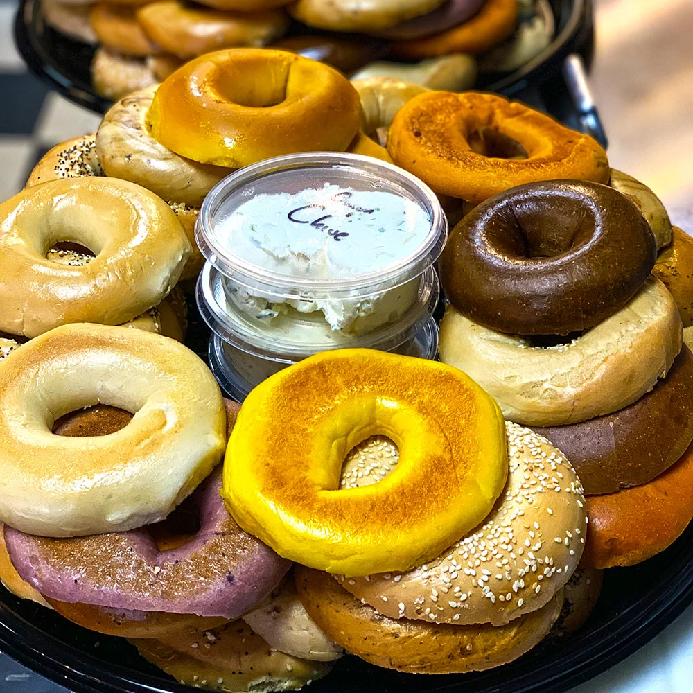 Assorted bagels and spreads on a Bagel Bistro catering platter